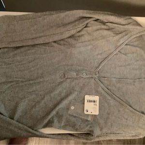 Never worn XS Free People gray, long sleeve, v-neck soft henley. Just wrinkled.